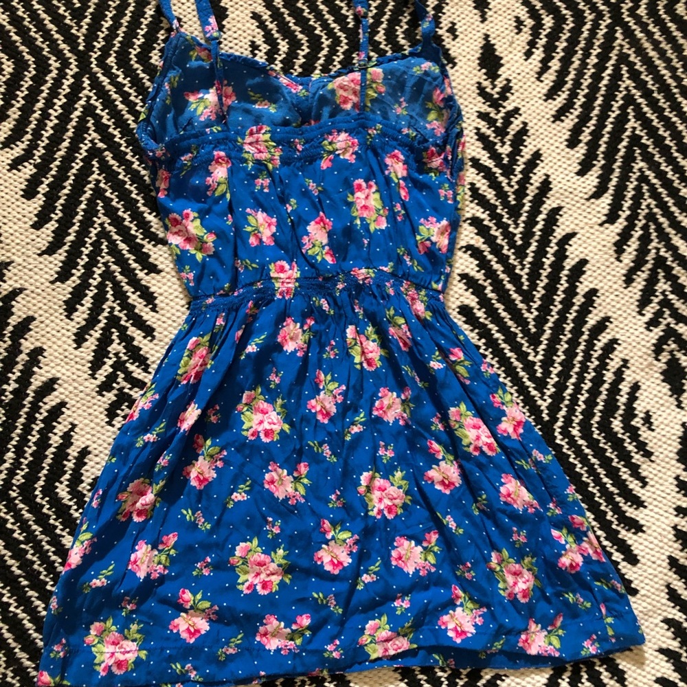 Floral cobalt blue spaghetti strap mini dress with buttons and adjustable straps